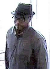 Male suspect with hat and glasses